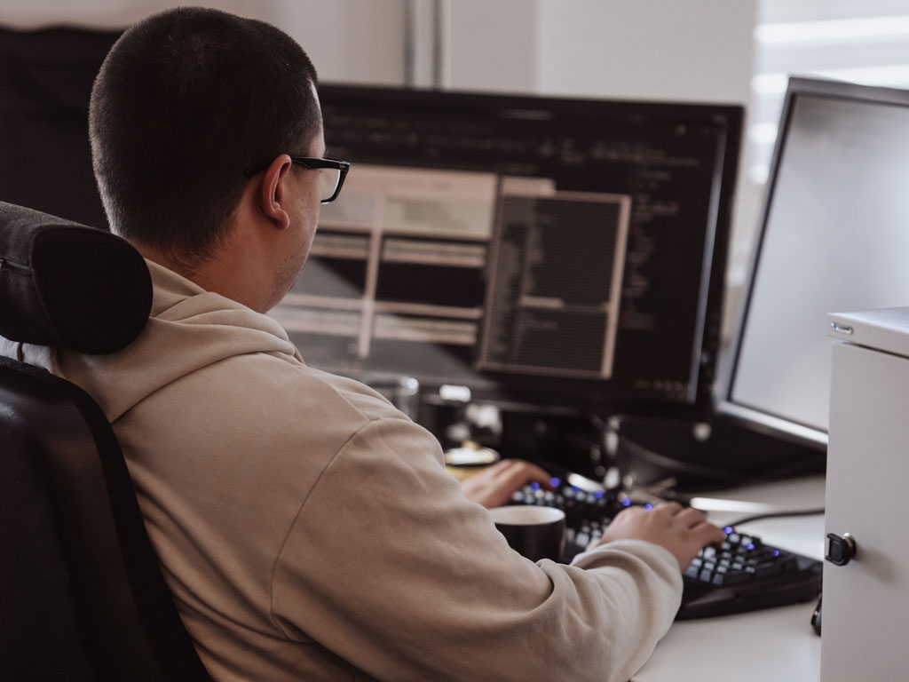 guy-playing-an-ukelele-in-a-chair