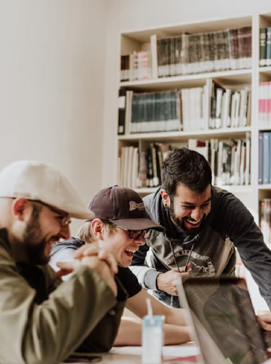 smiling-people-infornt-of-a-computer
